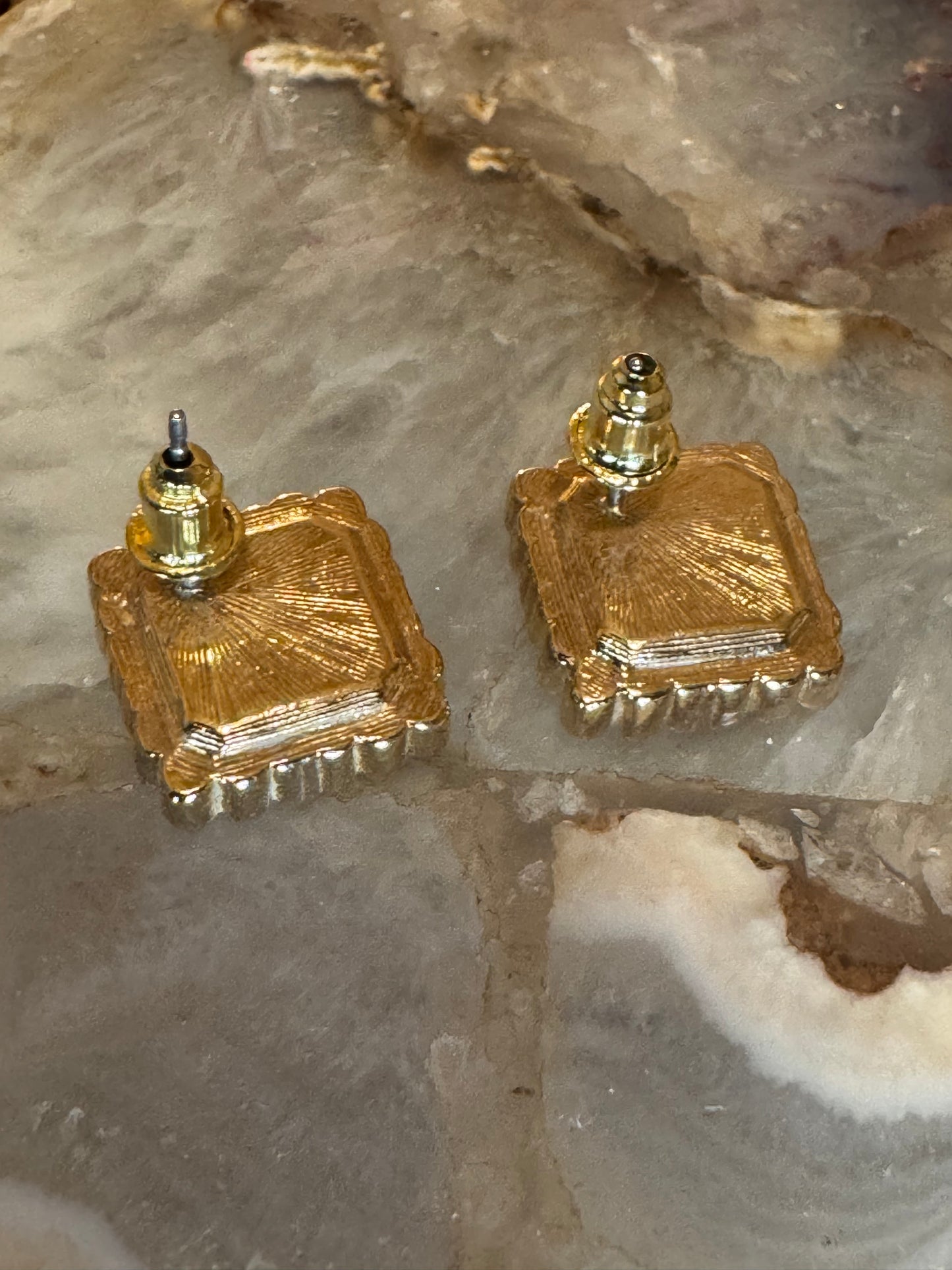 Vintage Avon square gold-plated earrings with a central emerald-cut green rhinestone accented by clear round stones