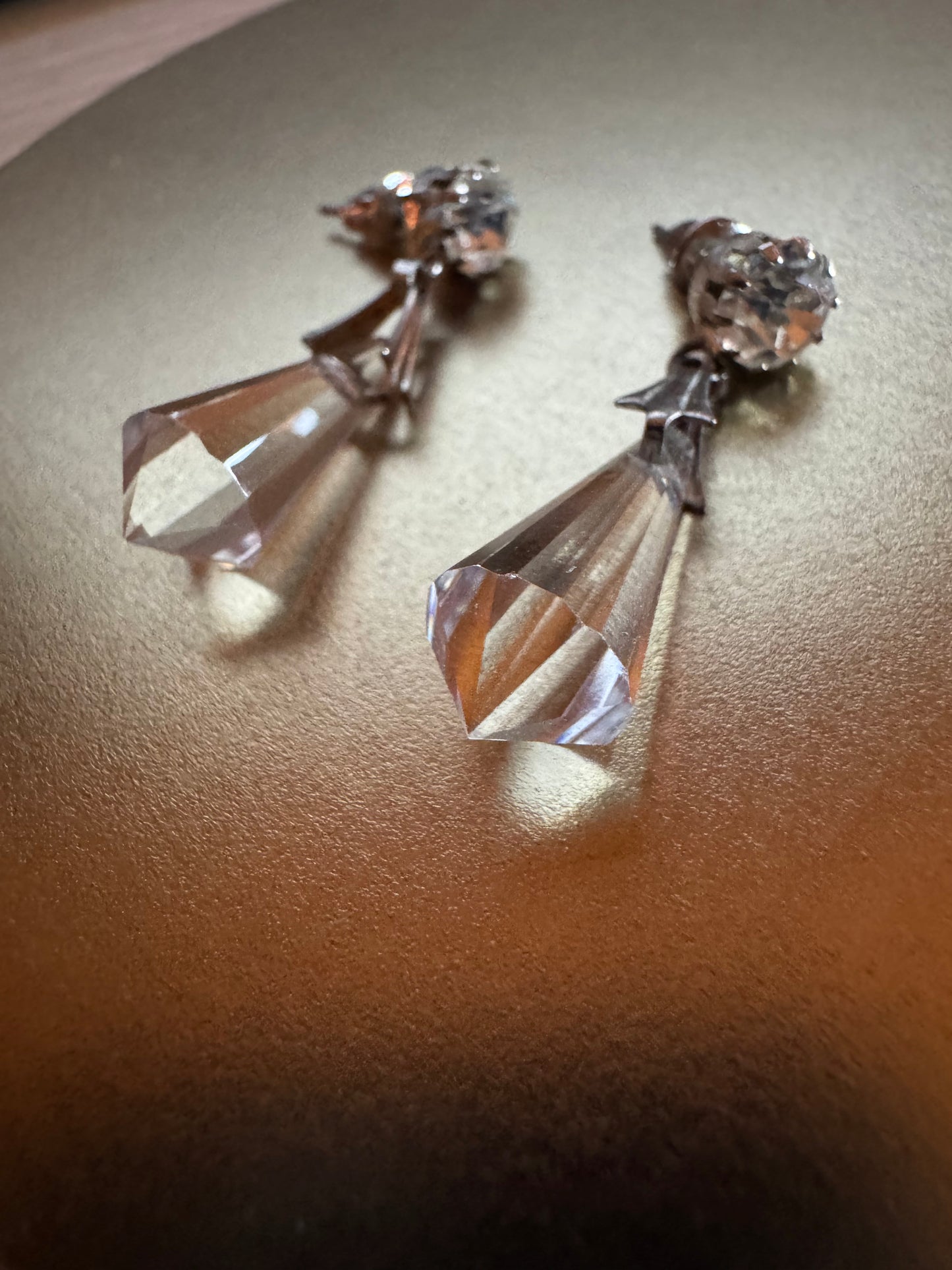 Vintage inspired silver tone linear drop earrings featuring faceted clear glass crystal icicle drops