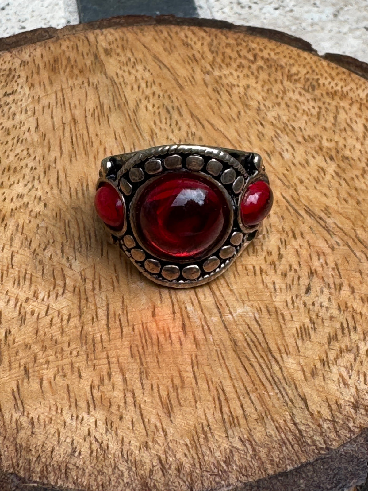 Vintage-style chunky silver statement ring featuring a prominent red cabochon stone