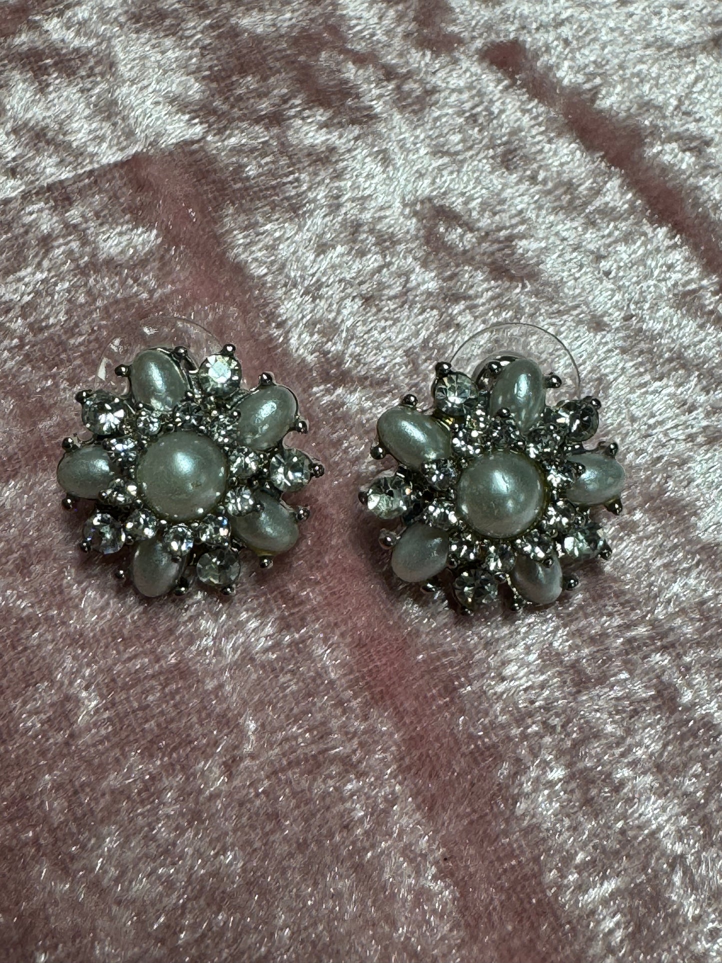 Vintage-style rhinestone earrings featuring a starburst or floral design