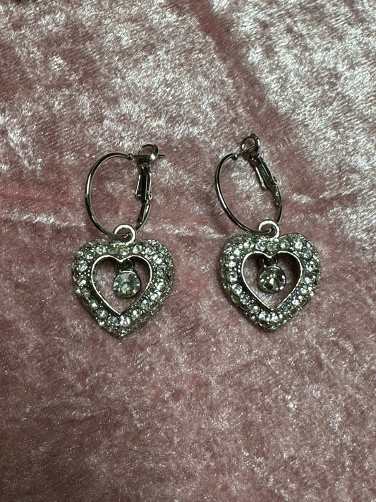 Vintage silver-tone drop earrings featuring crystal heart pendants