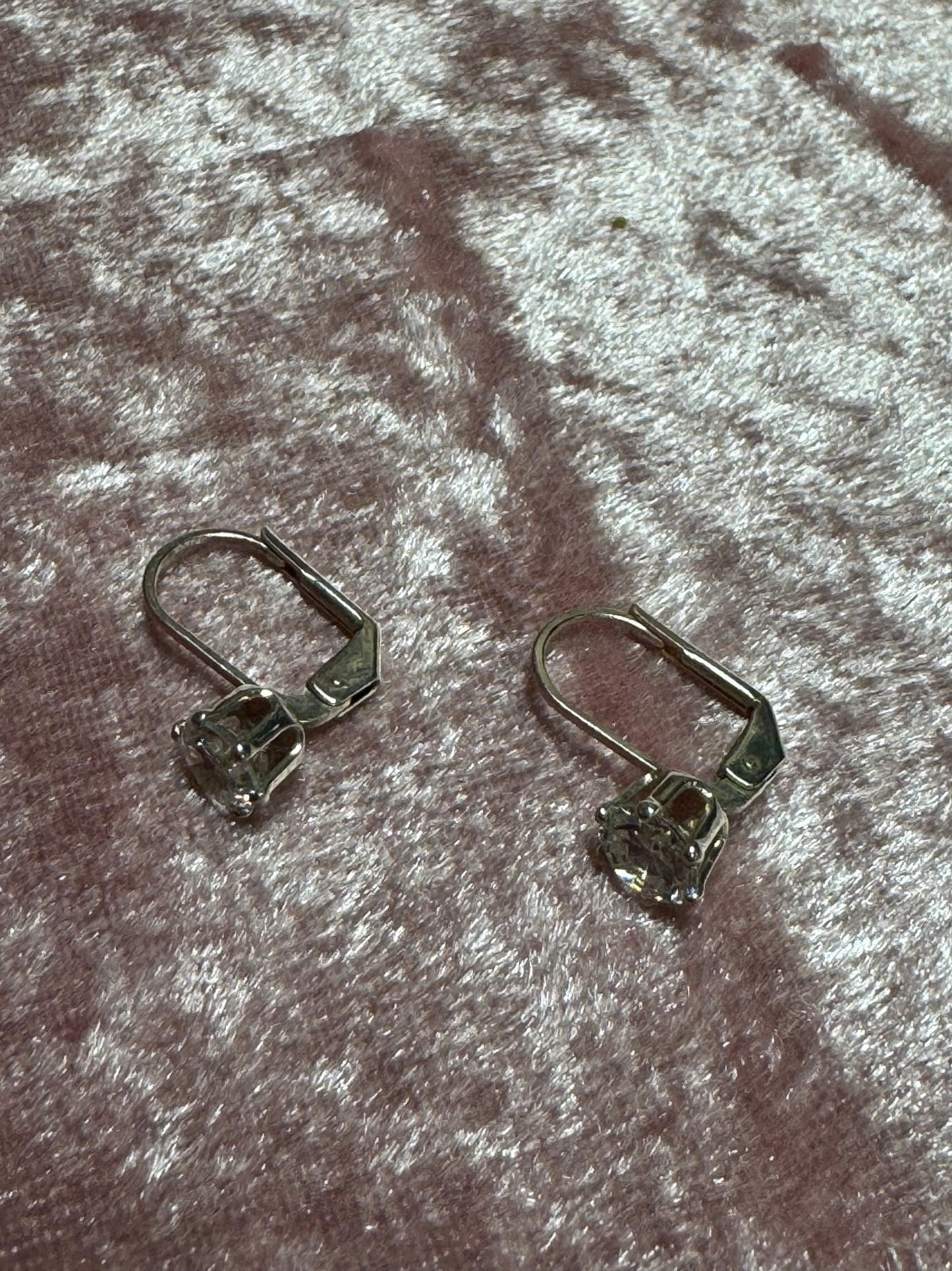 Silver-plated leverback earrings featuring a round solitaire cubic zirconia