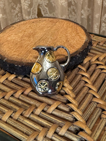 Vintage Liz Claiborne lemonade pitcher brooch pin featuring a two-tone gold and silver design