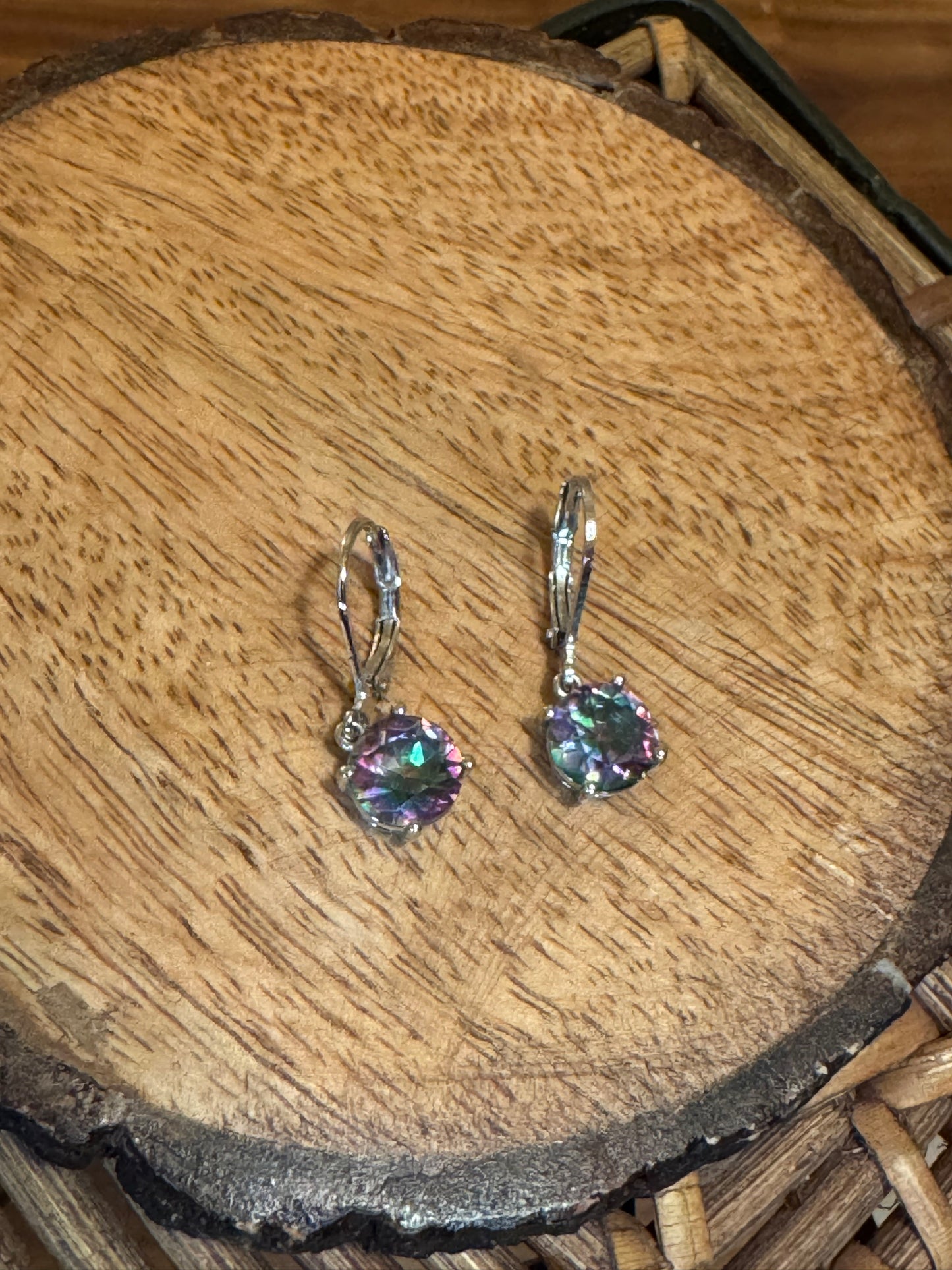 Sterling silver leverback dangle earrings featuring round-cut iridescent mystic topaz gemstones