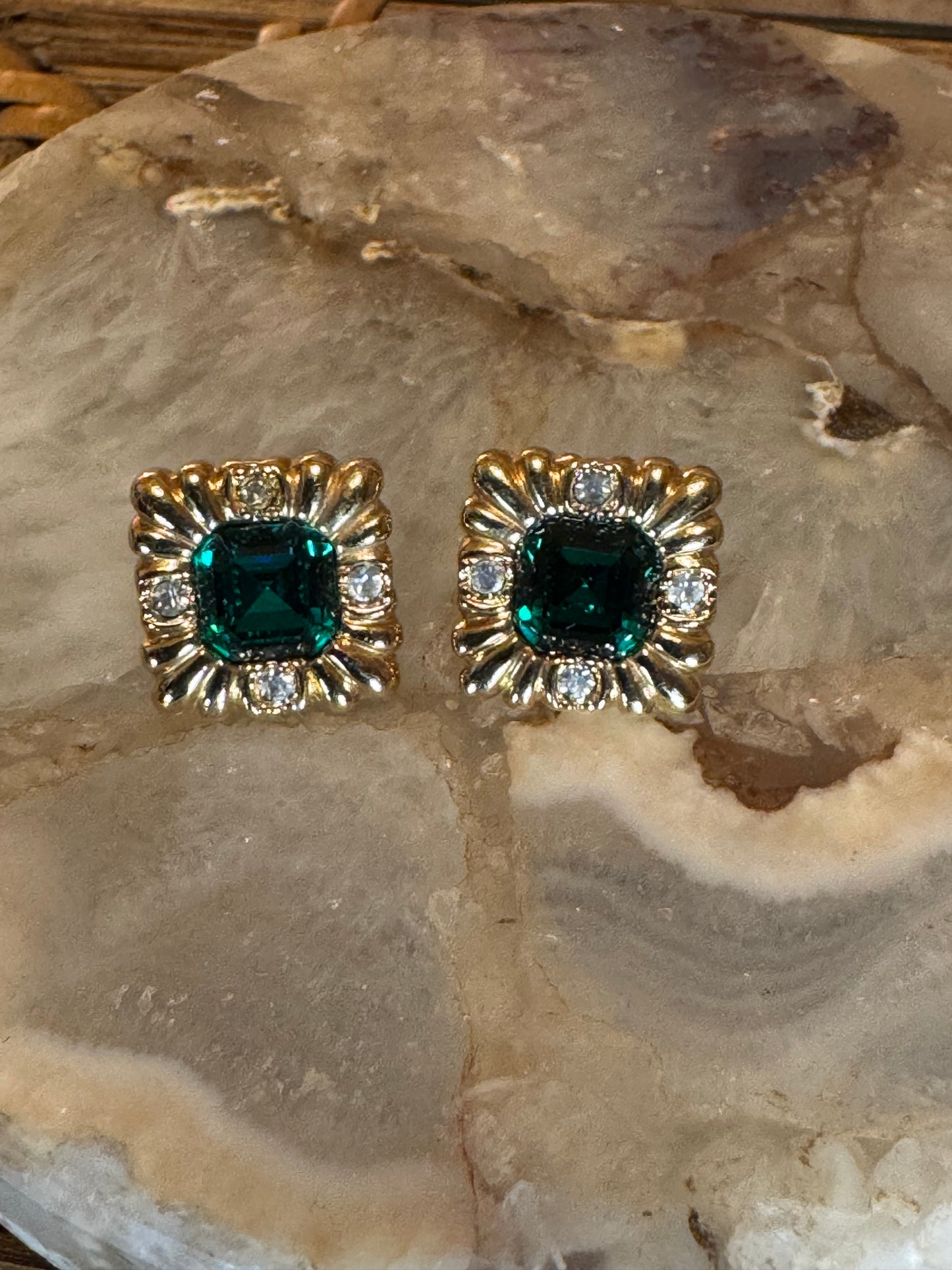 Vintage Avon square gold-plated earrings with a central emerald-cut green rhinestone accented by clear round stones