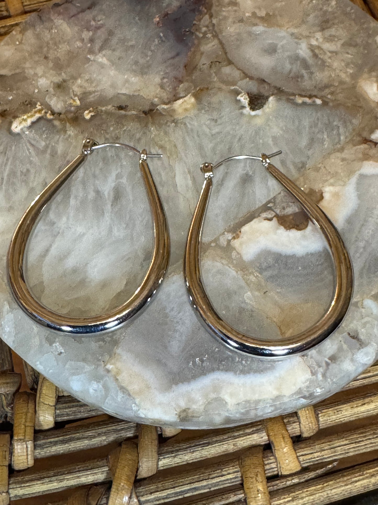 Polished silver-toned teardrop hoop earring