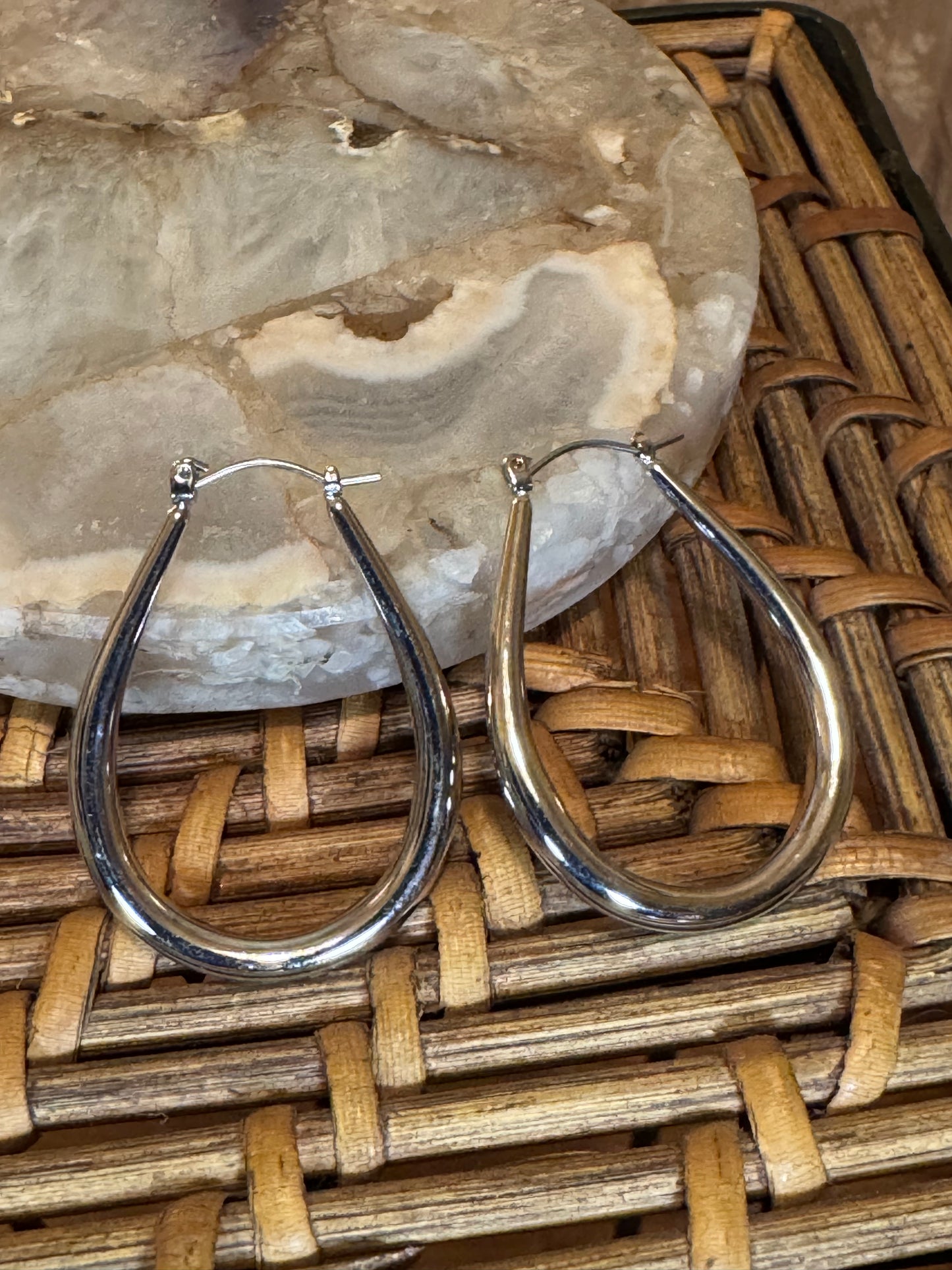 Polished silver-toned teardrop hoop earring