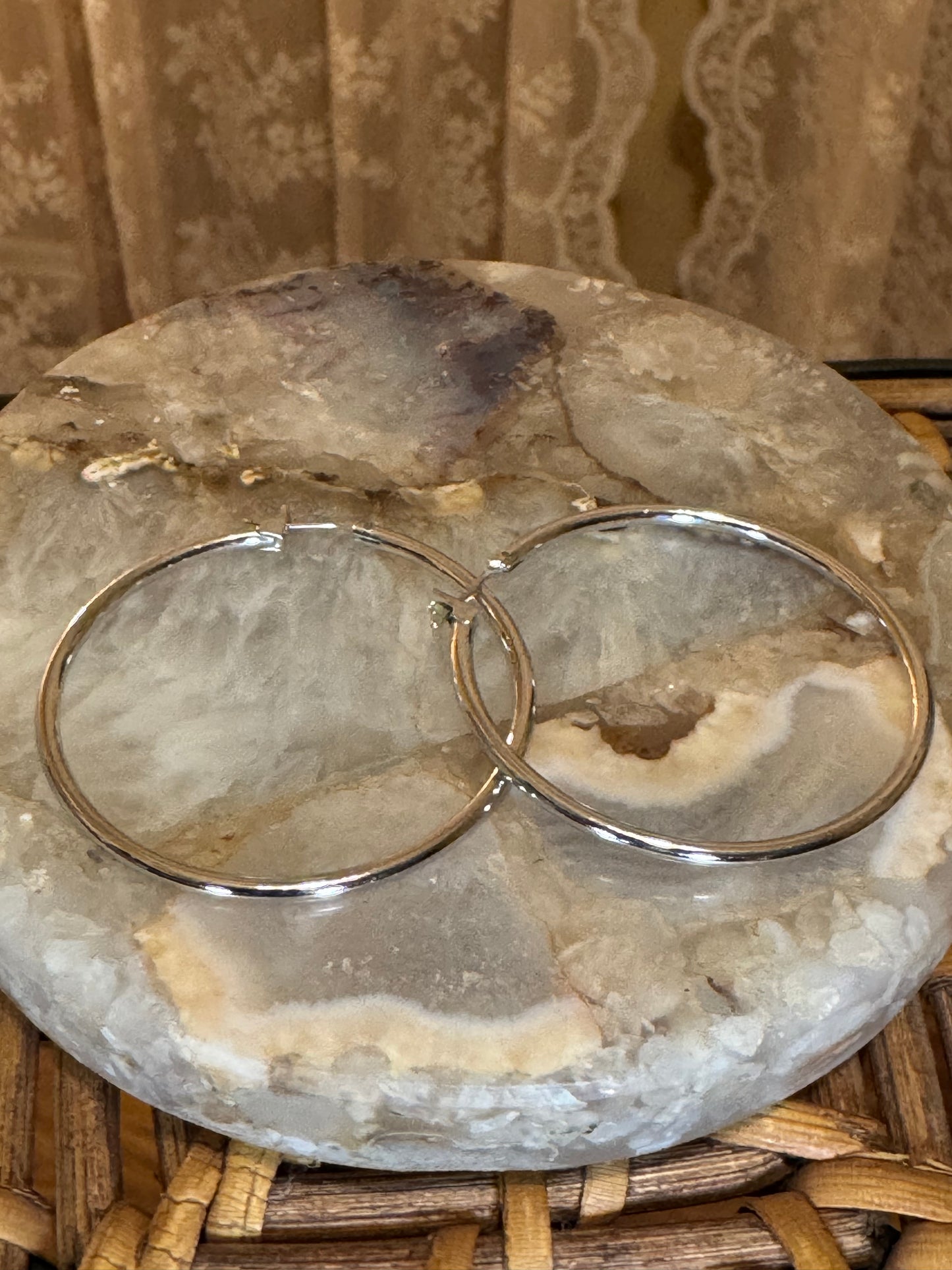 Polished silver-toned hoop earring
