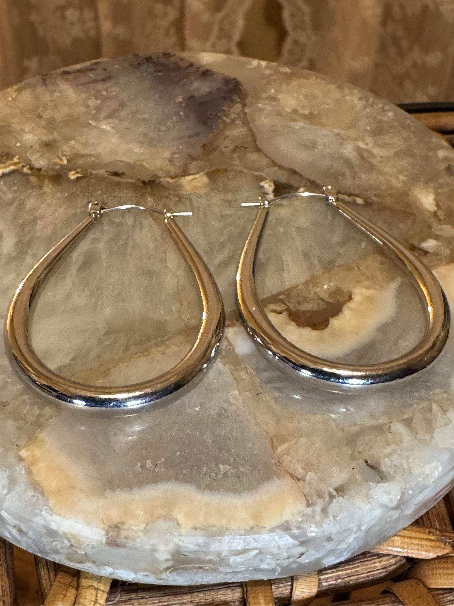 Polished silver-toned teardrop hoop earring