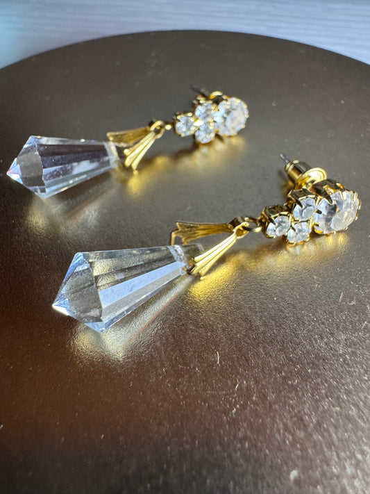 Vintage inspired gold tone linear drop earrings featuring faceted clear glass crystal icicle drops