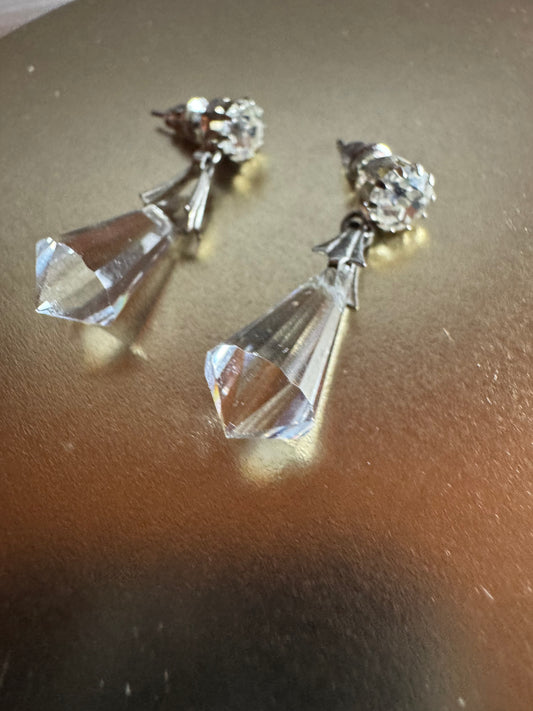 Vintage inspired silver tone linear drop earrings featuring faceted clear glass crystal icicle drops