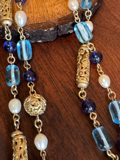Lia Sophia necklace features a long, beaded design with a blue, gold-tone, and faux pearl color scheme