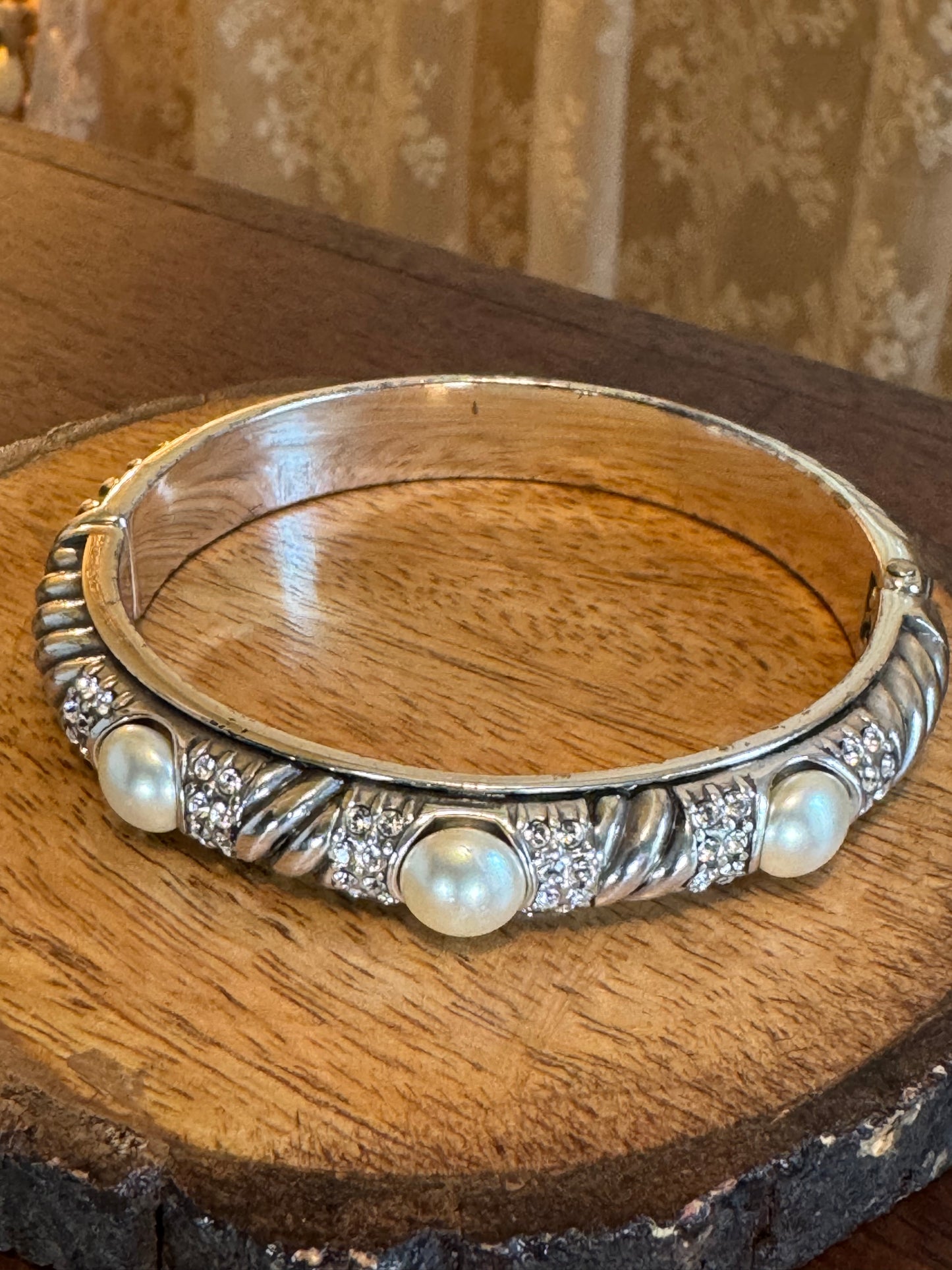Vintage signed Brighton "Pearl Magic" silver-plated hinged bangle bracelet featuring faux pearls and clear crystals