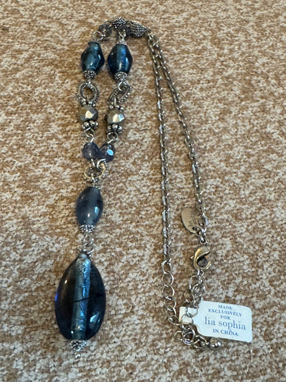 Lia Sophia "Buena Vista" necklace featuring shimmering blue glass beads and silvery accents in a Y-drop design.