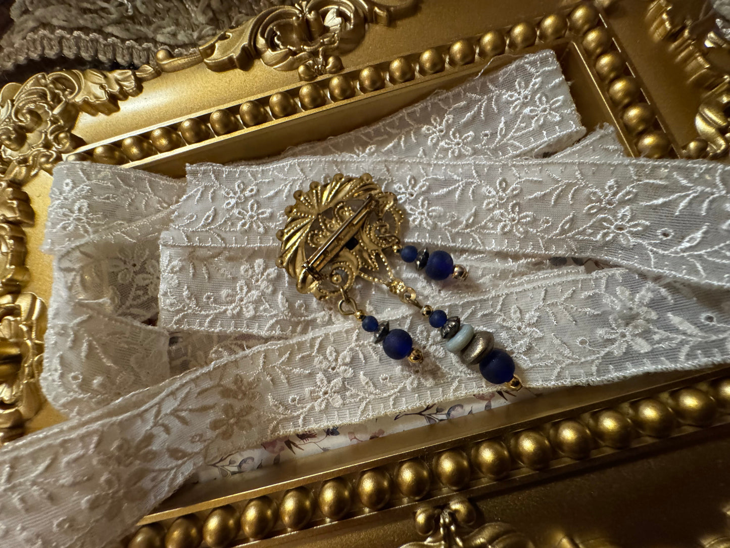 Vintage Gold-Tone Filigree Brooch with Blue Stones