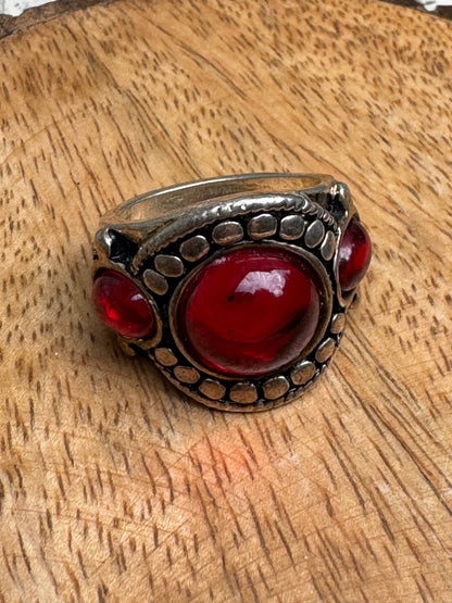 Vintage-style chunky silver statement ring featuring a prominent red cabochon stone